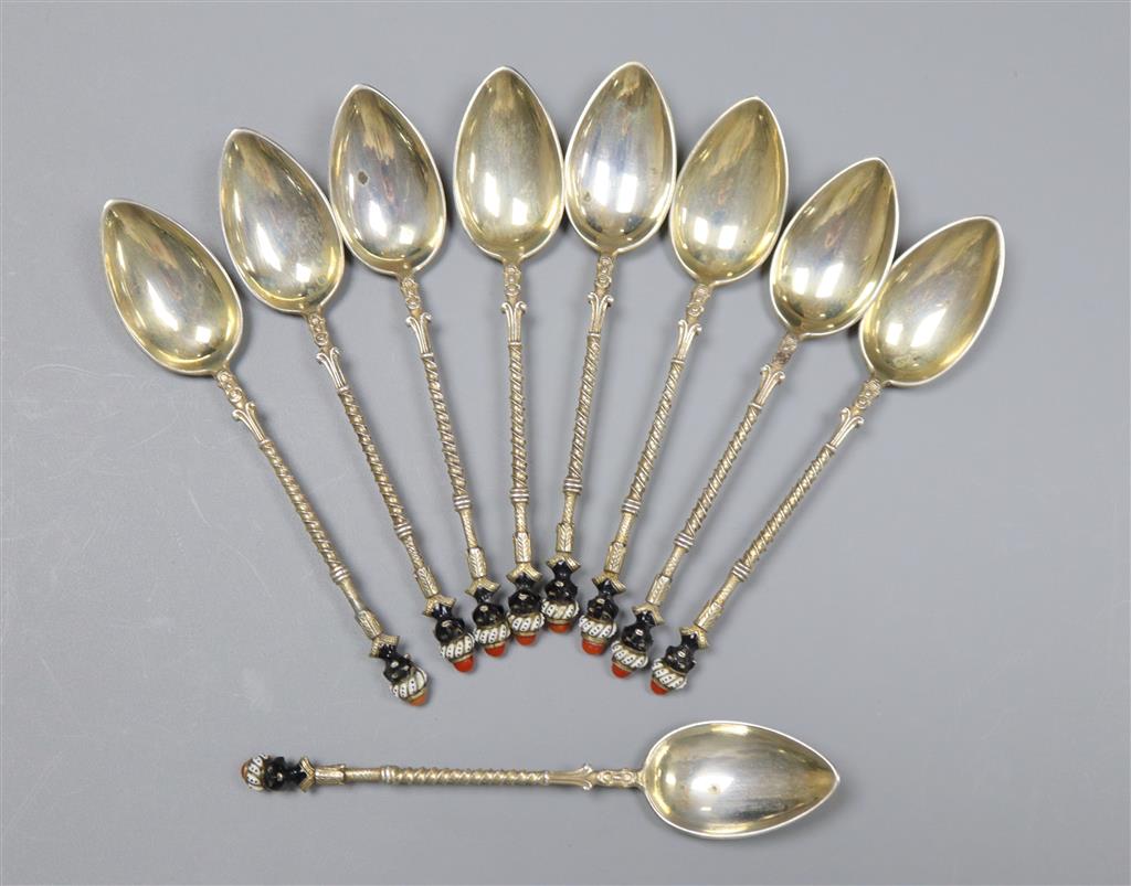 A set of nine early to mid 20th century Austro Hungarian white metal and enamel coffee spoons,